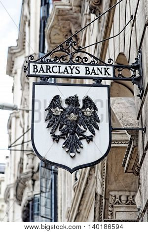 LONDON - JULY 1 2014: Vintage sign of Barclays bank branch in the City of London. Barclays was founded in 1690 and currently employs 146100 staff (2011).