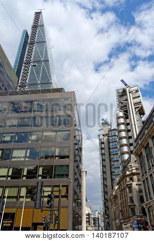 LONDON UK - JULY 1 2014: The famous office buildings - The Cheesegrater (Leadenhall Building) and the Lloyd's Building in the City of London one of the leading centers of global finance.