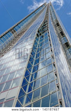LONDON UK - JULY 1 2014: The Shard skyscraper designed by the Italian architect Renzo Piano has 87 storeys over a height of 1004 feet. The Shard is the tallest building in Europe.