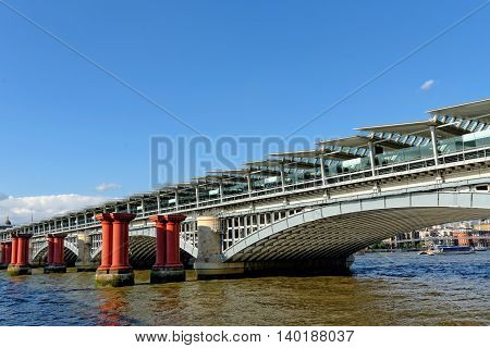 Remains of old and the new railway bridge at Blackfriars river Thames London