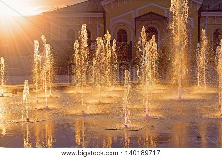 A fountain at Poshtova square under the bright sunbeams Kiev Ukraine