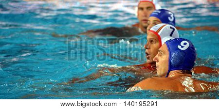 Budapest Hungary - Jul 14 2014. Daniel Varga (HUN 9) and Balazs Sziranyi (ESP 7) waiting for the ball. The Waterpolo European Championship was held in Alfred Hajos Swimming Centre in 2014.