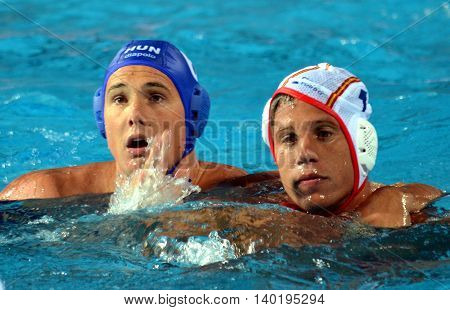 Budapest Hungary - Jul 14 2014. Balazs Sziranyi (ESP 7) and Norbert Hosnyanszky (HUN 6) fighting for the ball. The Waterpolo European Championship was held in Alfred Hajos Swimming Centre in 2014.
