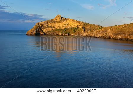 Beautiful Cape Kapchik in Black Sea illuminated the rising sun. Crimea.