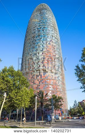 BARCELONA SPAIN - JULY 10 2016: The Agbar Tower - is a skyscraper of 38 floors in Barcelona. The tower was designed by architect Jean Nouvel.