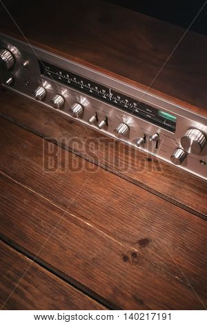 Vintage audio stereo rack with cassette tape deck receiver and speaker, angled view