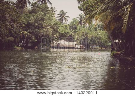 Allepey, Kerala, India, March 31, 2015: Backwater boats. Channels on the river in the city of Allapuzha.