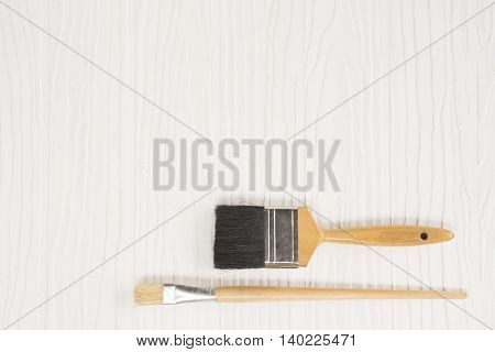 Paint brush on white pattern background suitable for background paint or background diy or background decorate house and equipment or household.