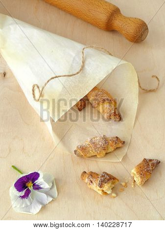 Small Homemade Rugelach with Sugar, One Cut in Half