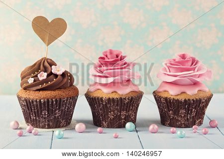 Cupcakes with heart cakepick for text