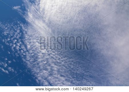Natural blue sky with Cirrus radiatus, cirrocumulus clouds formation