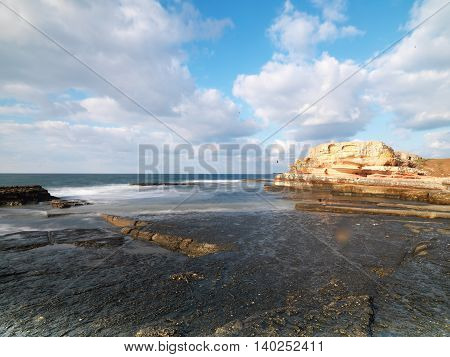 Long exposure shot on amazing pink rocks and sea
