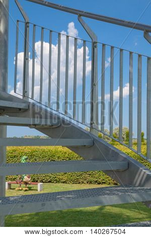 Metal observation tower with a spiral staircase.