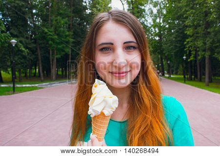 Girl in summer day eating cool ice cream.