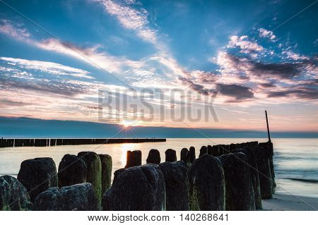 Wooden poles breaking sea water long exposure. Poland Baltic Ustronie Morskie.