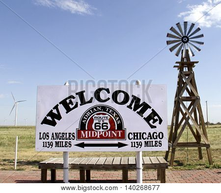 Historic route 66 sign showing the midpoint between Los Angeles and Chicago