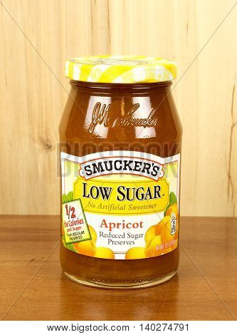 RIVER FALLS,WISCONSIN-JULY 27,2016: A jar of Smucker's brand reduced sugar Apricot Preserves.