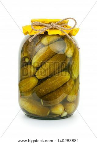 Homemade Pickled Cucumbers In Glass Jar With Yellow Paper Wrapper. Jar Of Canned Cucumbers Isolated