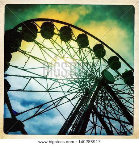 canival ferris wheel with a retro vintage instagram filter app or action