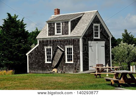 Brewster Massachusetts - July 14 2015: 1867 Henry Hopkins Blacksmith Shop at the 18th century Higgins Farm Windmill historic site on Cape Cod