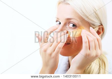 Gold mask, skin care around the eyes. Gold pads, reduction of wrinkles