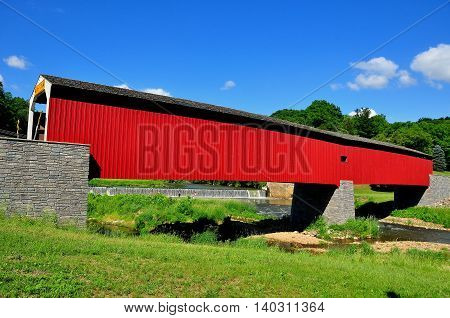 Asheville Pennsylvania - June 6 2015 1884 vernacular Burr arch-truss wooden covered bridge over the Octoraro Creek *