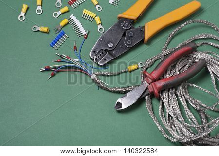 Set of electrical tool on wooden background. Accessories for engineering work, energy concept
