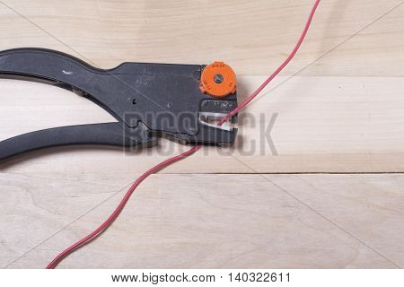 Set of electrical tool on wooden background. Accessories for engineering work, energy concept