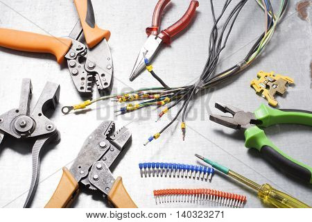 Set of electrical tool on wooden background. Accessories for engineering work, energy concept