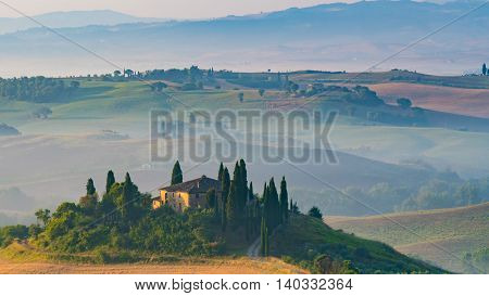 PIENZA, ITALY - JULY 7, 2016: Tuscan villa on a hill in the Tuscany regionnear the village Pienza, Italy