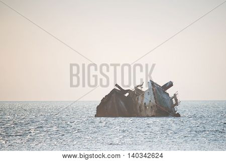 Sunken ship at sea during the day. Black sea