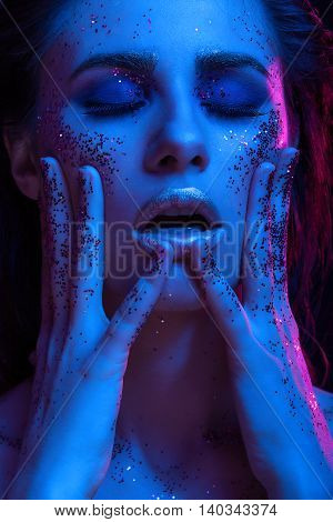 Portrait Of Woman Coverd In Glitter In Fashion Light