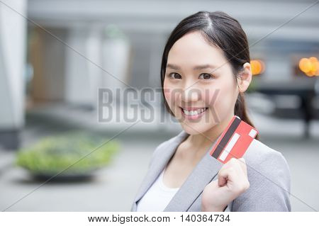 businesswoman take a credit card and go shopping in hon kong asian