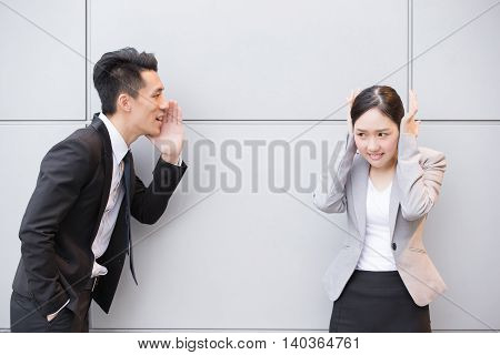 Businesspeopple is shoting angry with the gray wall in Hong Kong asian