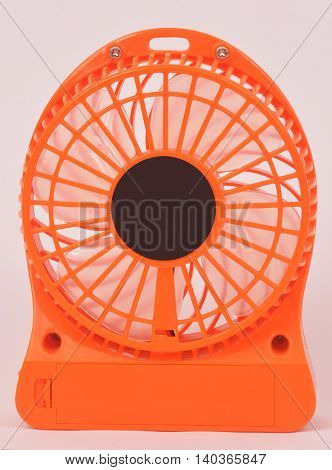 Orange mini fan Portable fan USB on white background