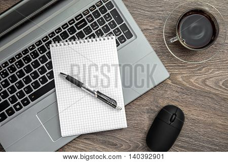 Business still life with laptop notebook and coffee