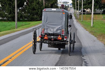 Lancaster County Pennsylvania - October 13 2015: An Amish buggy driving along Route 772 near the town of Intercourse