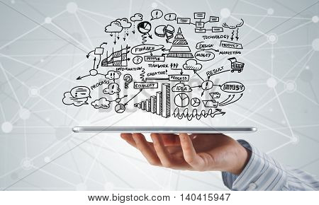 Businessman hand demostrating business strategy plan on tablet screen