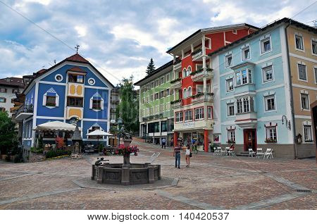ORTISEI ITALY - JUNE 26: View of the main square of Ortisei town Italy on June 26 2014. Ortisei is a ski resort in Dolomites Alps Italy.