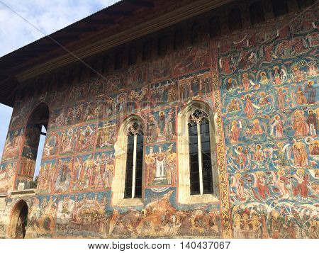 Romania, August 23, 2015, Vatra Moldovitei, North Moldova, Monastery lateral painted wall