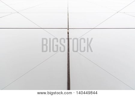 Contemporary architectural detail. Metal tilies facade close up