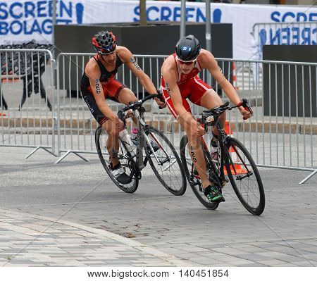 STOCKHOLM SWEDEN - JUL 02 2016: Male triathlete cyclists Andreas Schilling and Xavier Grenier-Talavera in the Men's ITU World Triathlon series event July 02 2016 in Stockholm Sweden