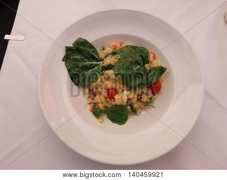Couscous (aka seksu or kuskus) traditional berber North African steam cooked dish of durum wheat semolina granules