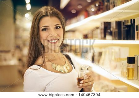 Smiling woman in a perfumery