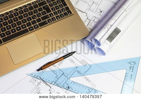 An office desk with the project papers