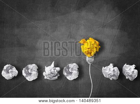 Inspiration concept with crumpled paper light bulb as good idea