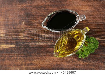 olive oil and balsamic vinegar in a glass gravy boat