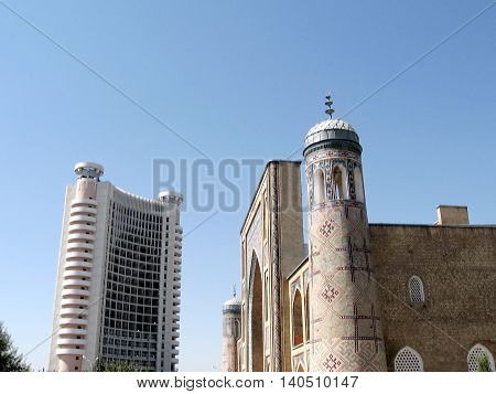 Tashkent Uzbekistan - September 13 2007: Kukeldash Madrassah and modern building in Chorsu.