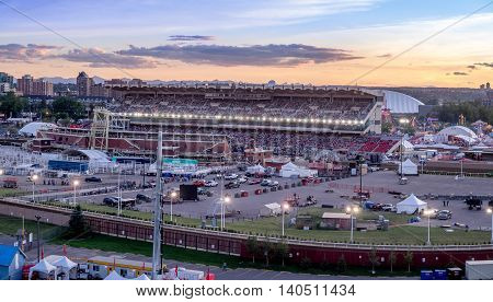 CALGARY, CANADA - JULY 8: Panoramic view of the the Calgary Stampede at sunset on July 8, 2016 in Calgary, Alberta. The Calgary Stampede is often called the greatest outdoor show on Earth.
