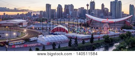 CALGARY, CANADA - JULY 8: Panoramic view of the the Calgary Stampede at sunset on July 8, 2016 in Calgary, Alberta. The Calgary Stampede is often called the greatest outdoor show on Earth.